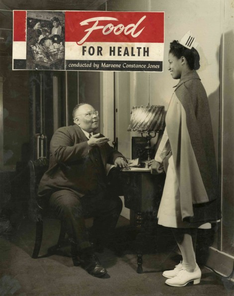 [Marvene C. Jones talking with an unknown man]