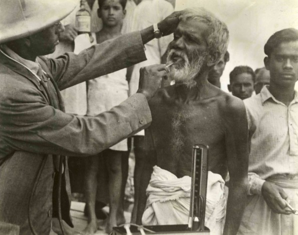 [Unknown doctor aiding an unknown man in an unknown country]