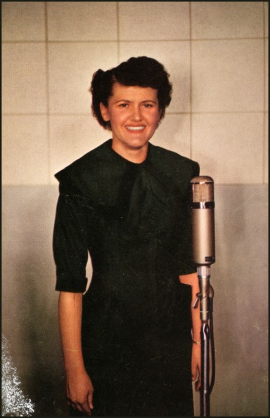 Del Delker standing in front of a microphone