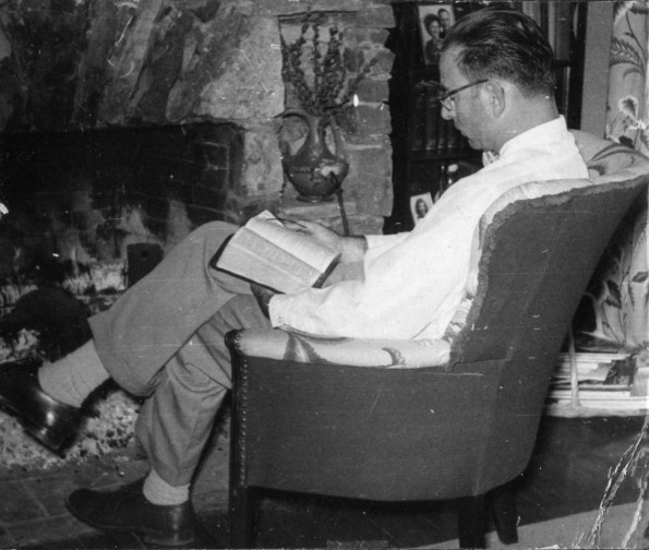 [Bernard Bowen reading by the fire place]