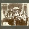 [A group of unknown people, possibly in front of one of the buildings of the Battle Creek Sanitarium]