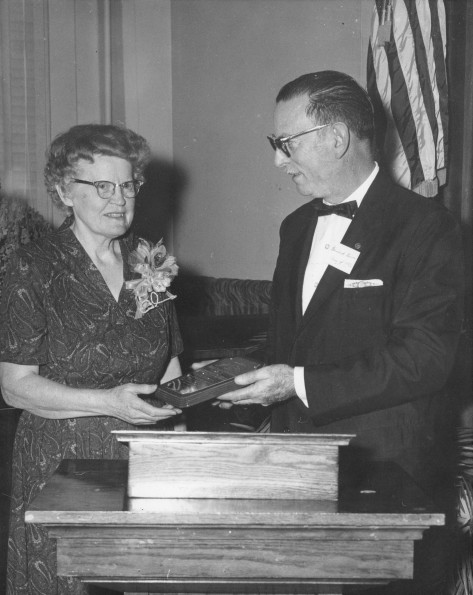 [Bernard V. Bowen presents a plaque to an unknown woman]