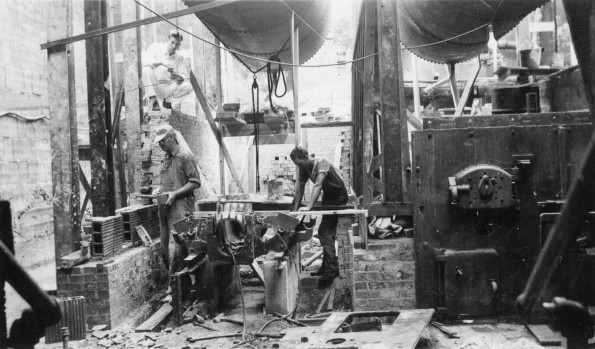 Installing central heat during the construction of an unknown building at Madison College