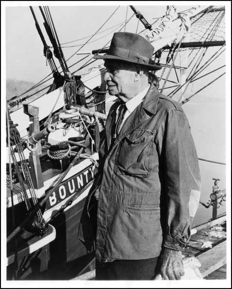 Parkin Christian standing beside the full scale model of the HMS Bounty