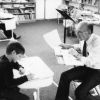 Harold Hiday assisting a student at the Mountain Home Seventh-day Adventist School