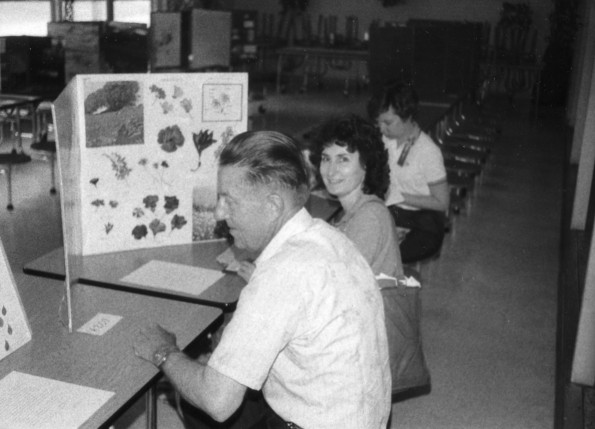 Buck Gifford and Tama Jo Hall judging student projects at the Pathfinder Education Fair in Alexandria, LA