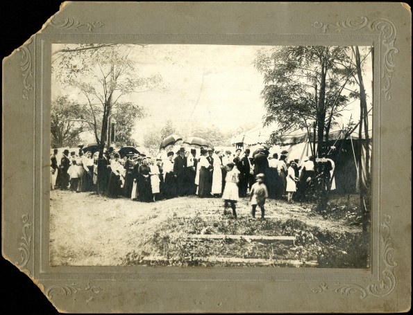 Group of people lined up to get into camp meeting tent
