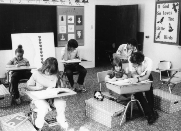 Mark Gutman assisting a student at Lafayette Seventh-day Adventist Church School