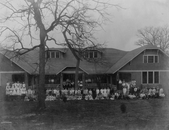 Unknown students and teachers gathered in front of the Helen Funk Assembly Hall at Madison College