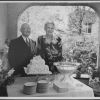 Edward and Bessie Sutherland posing with their wedding cake