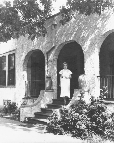 [Unknown woman standing in the entrance to the Madison Sanitarium Lounge Room]