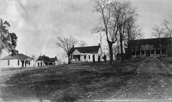 Two cottages, Kinne kitchen, and the "Old Manse" at Madison College in the winter