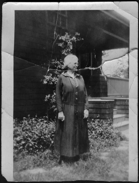Lida Scott in front of a house