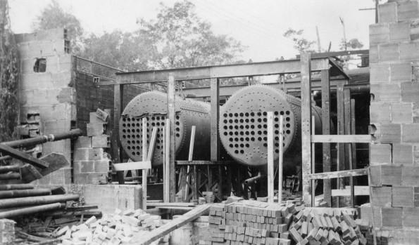 Installing central heat during the construction of an unknown building at Madison College