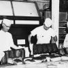 [John Brownlee and two unknown men baking bread]