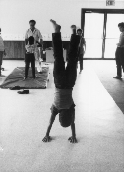 Roy Mortimer teaching gymnastics at Lake Charles Adventist School