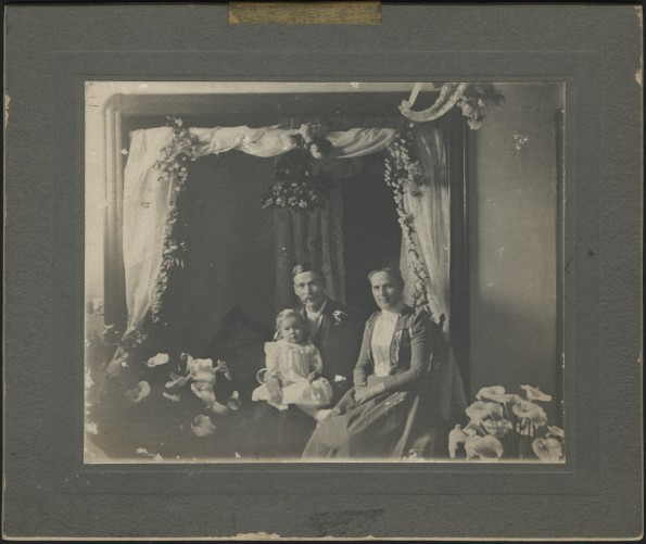 William, Nellie, and Winea Simpson in a studio portrait