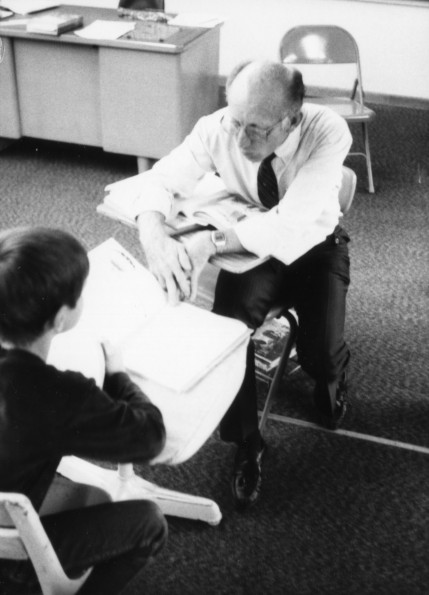 Harold Hiday assisting a student at the Mountain Home Seventh-day Adventist School